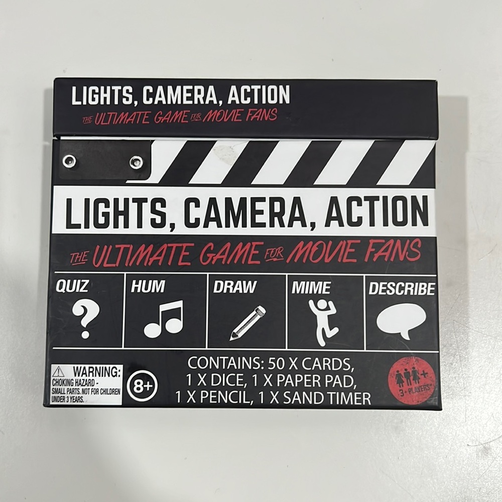 Lights , camera . Action game , pre-owned like new